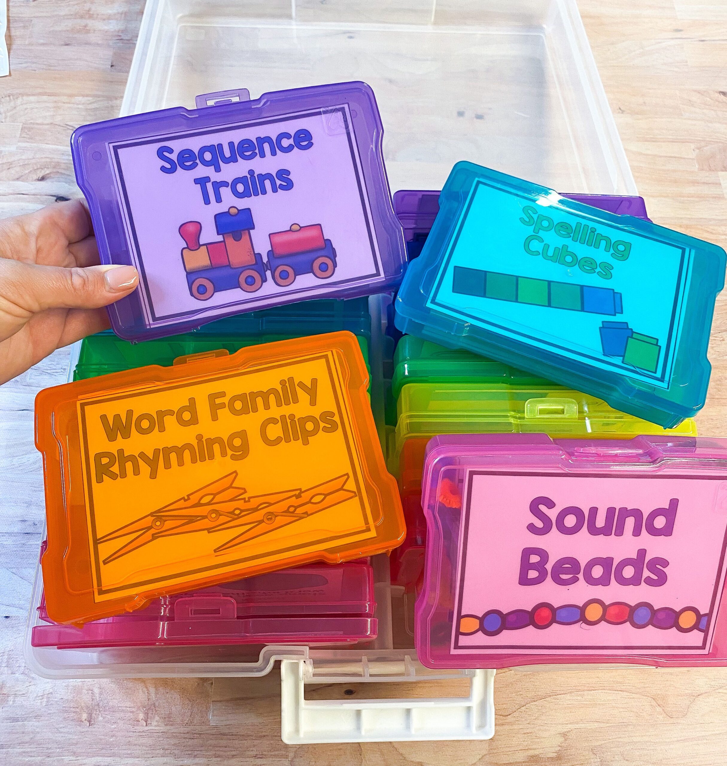 Hands-On Literacy Intervention centers using play-dough, plastic chains and clothespins to build fine motor skills during phonics practice.