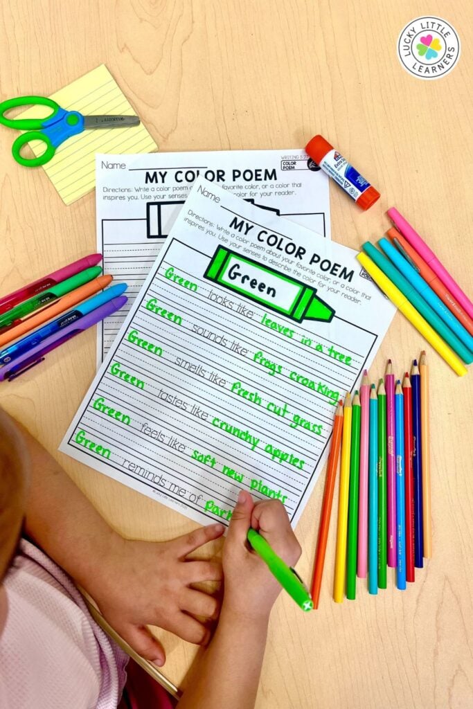 A 2nd grade student writing a color poem about the color green, describing its appearance, sounds, and sensations, promoting sensory learning through poetry.