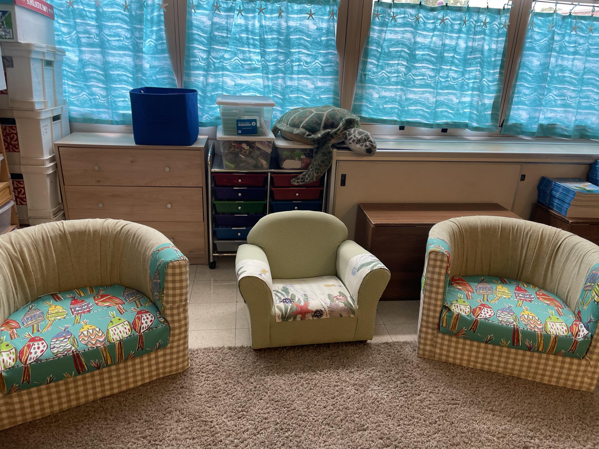 Tranquil underwater classroom theme with ocean wave curtains, starfish banners, and sea turtles.