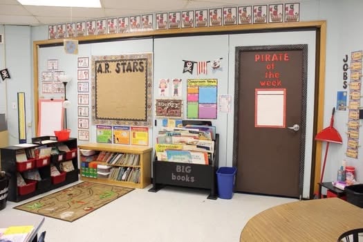 Pirate classroom theme setup with treasure chest reading nook.