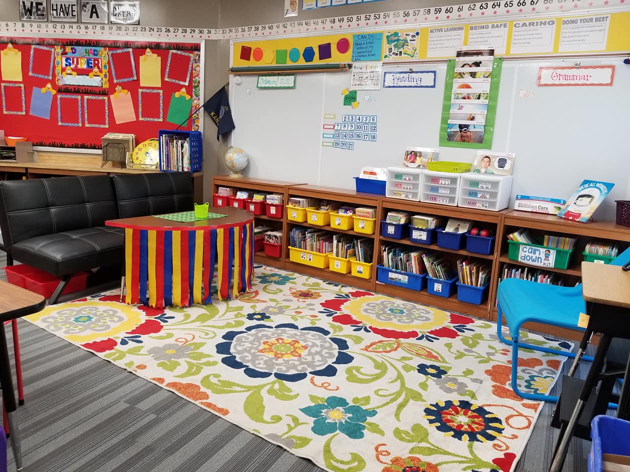 Superhero classroom library featuring bright primary colors.