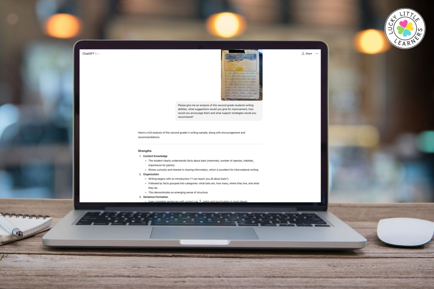 Laptop screen showing ChatGPT analyzing a second grader’s writing sample with strengths and improvement suggestions, demonstrating AI tools for teachers.