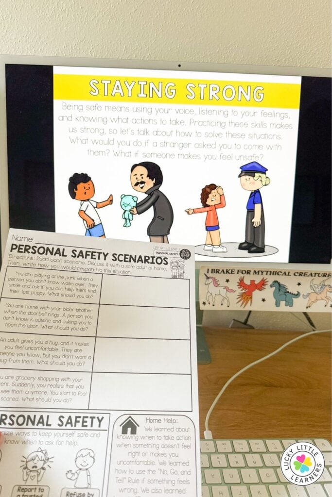 Personal safety lesson setup for teaching safety K-2 with a ‘Staying Strong’ slide and printable worksheet on safety scenarios, helping students learn how to respond in unsafe situations.