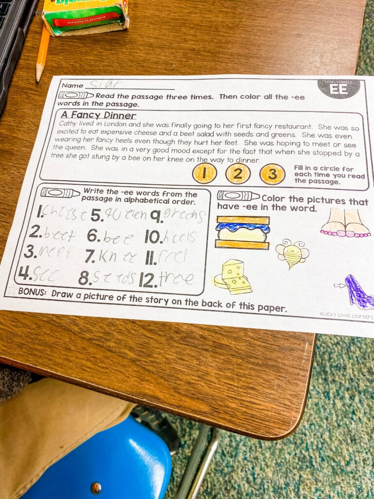 Image showing a phonics worksheet completed by a student as part of buddy reading activities focused on rereading and vowel patterns.