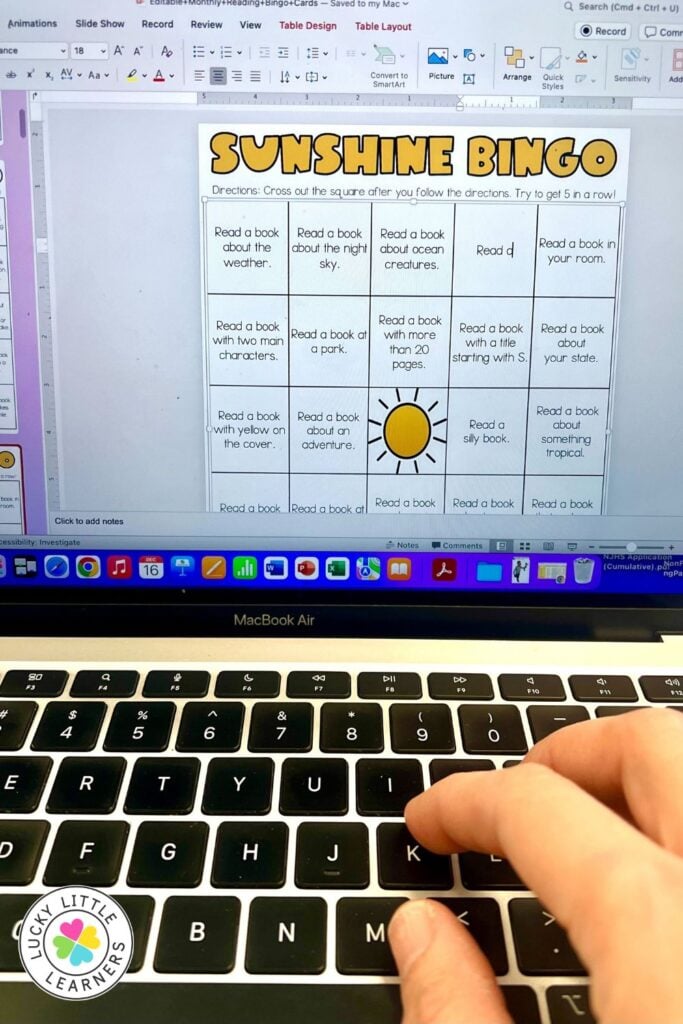 Image showing a reading homework BINGO board displayed on a laptop screen, featuring themed reading challenges for students to complete at home.