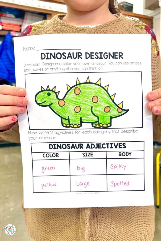Dinosaur designer writing activity from dinosaur day for first and second grade featuring adjectives and coloring