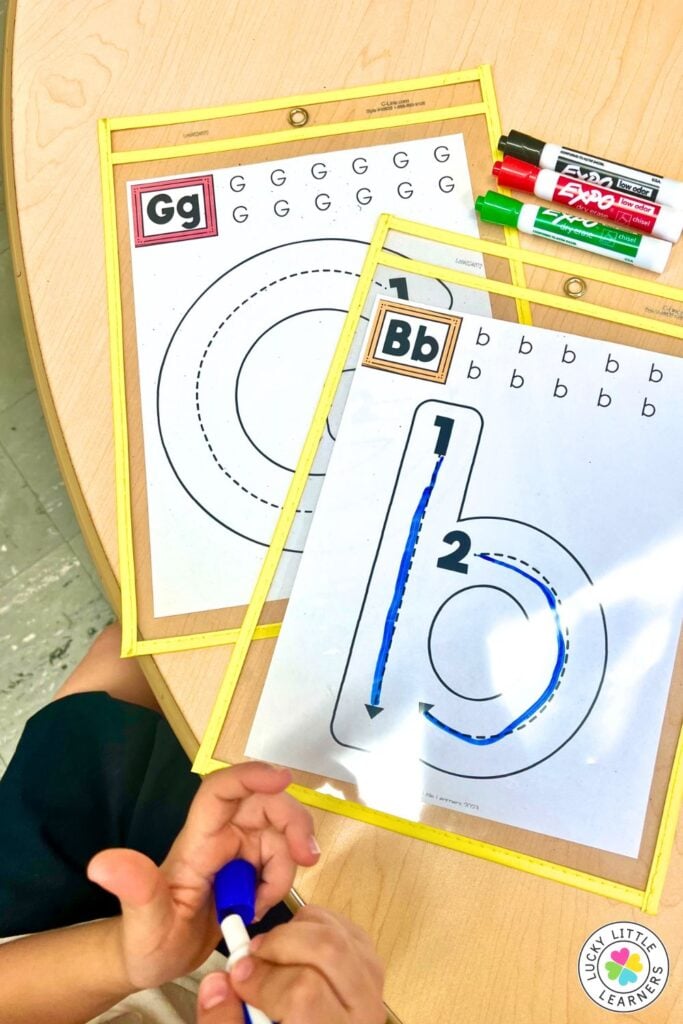 New kindergarten teacher literacy center featuring reusable dry erase alphabet tracing mats for handwriting and letter formation practice.